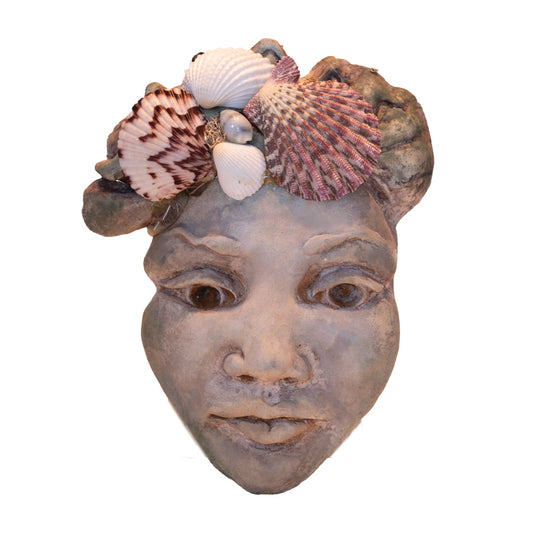 Hawaiian womans face with shells wall hanger.